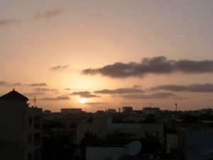 sharing the rooftop wonder with friends, a laughter-filled sunset